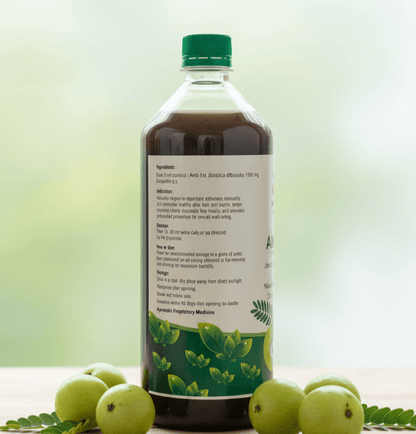 Cold Pressed Amla Juice bottle featuring natural ingredients and health benefits on label.