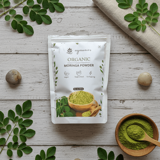 Package of Organic Moringa Powder with Moringa leaves and powder on a wooden surface